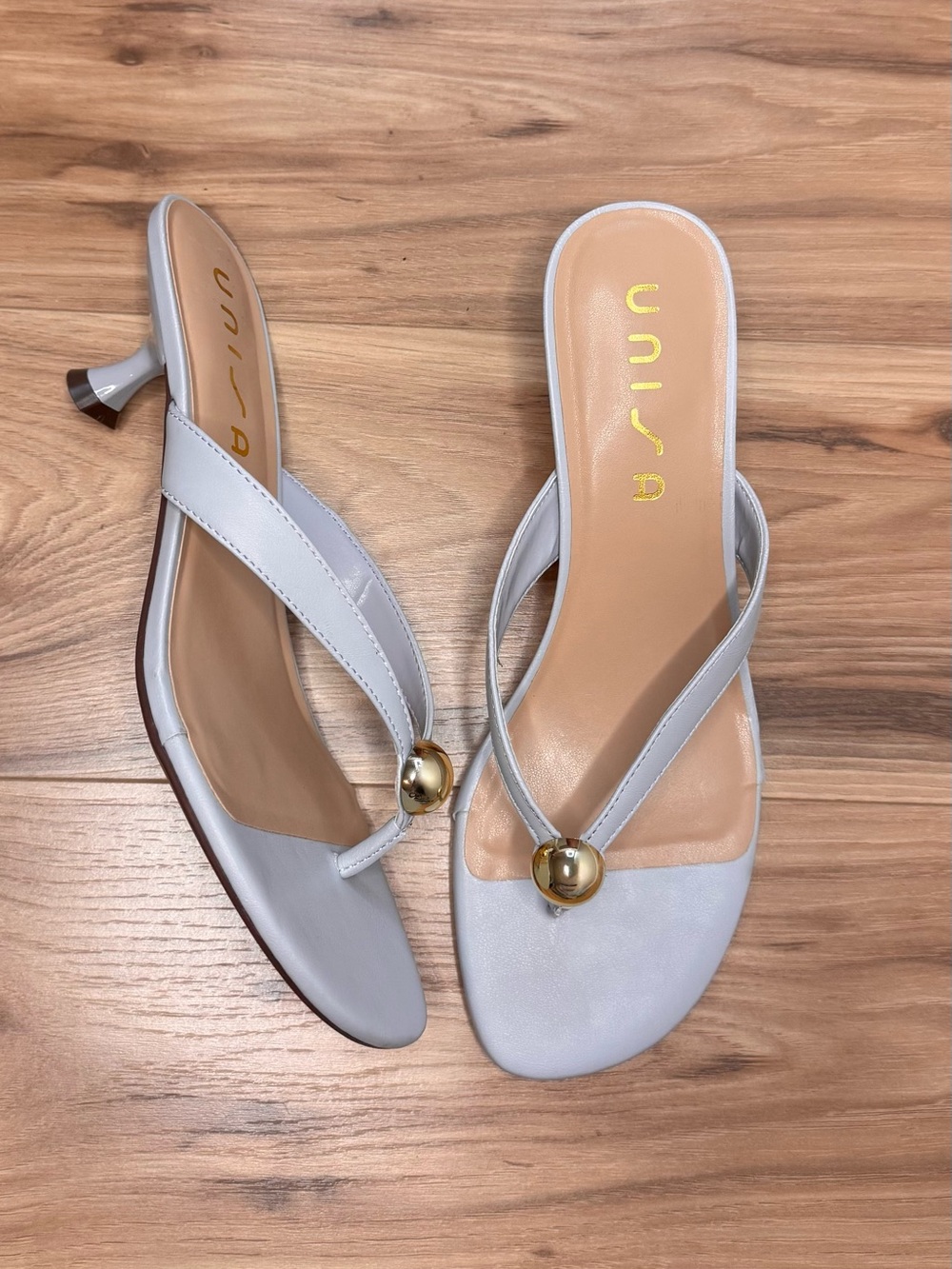 Unisa White Thong Mules with Gold Orb Accent